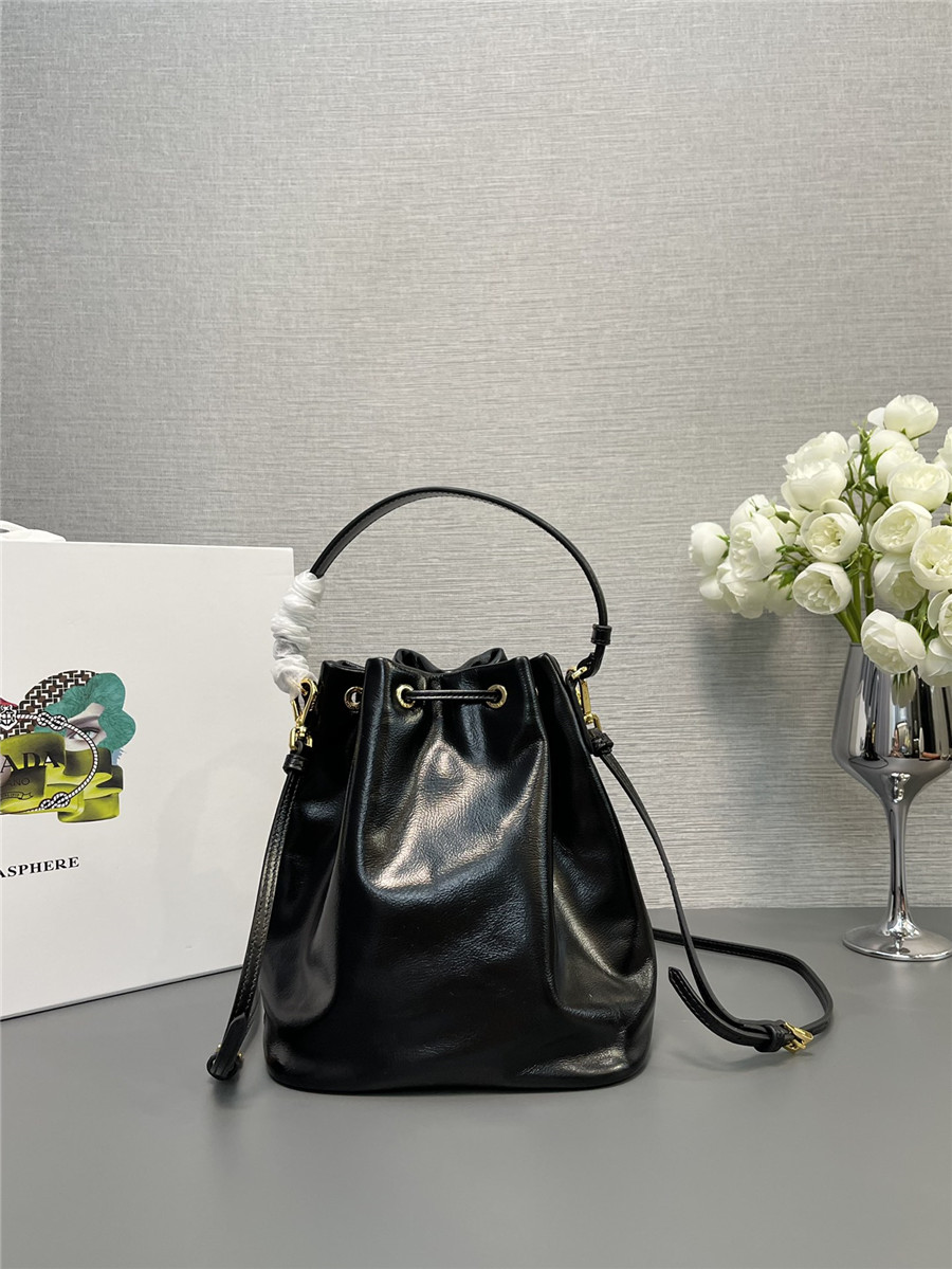 Pra*a black leather bucket crossbody bag