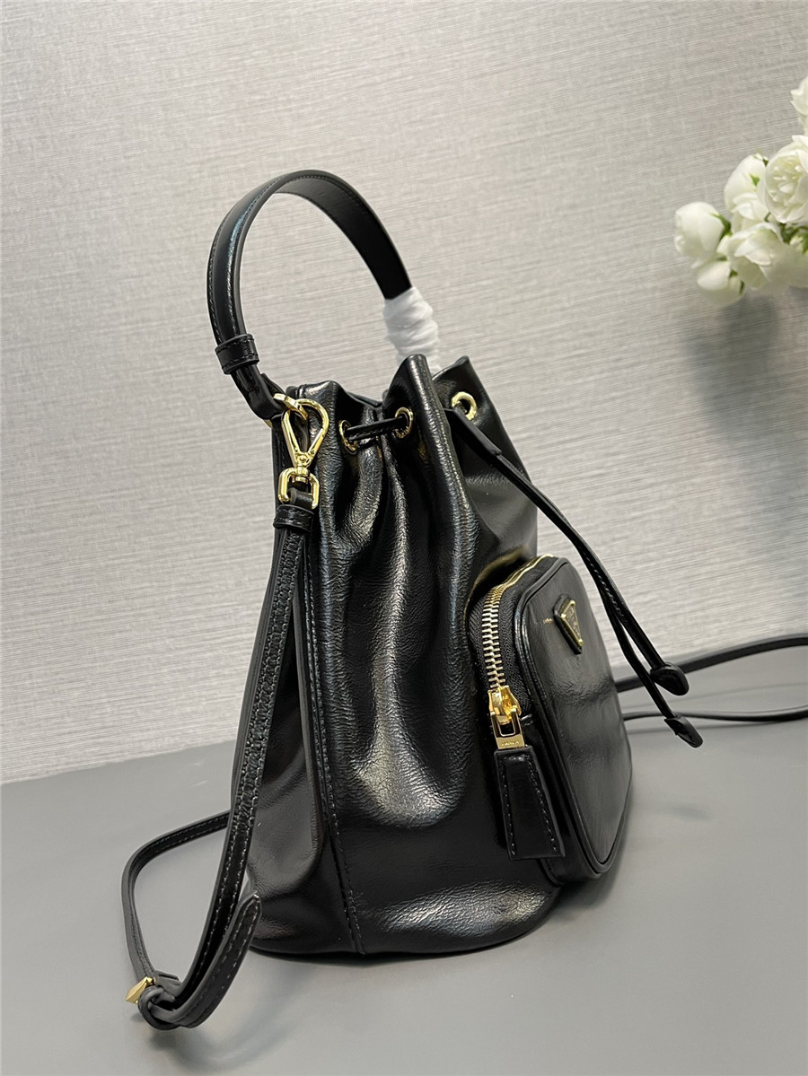 Pra*a black leather bucket crossbody bag