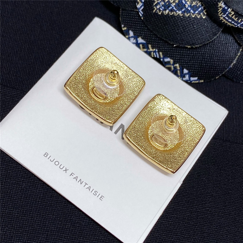 Ch**el white enamel Ch**el stud earrings