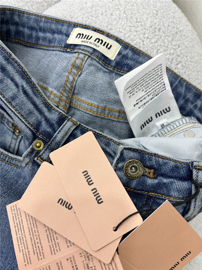 M1um1u waistband letter patch logo embellished jeans