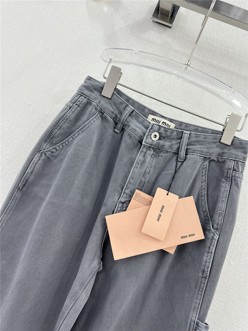 M1um1u waistband letter patch logo embellished jeans