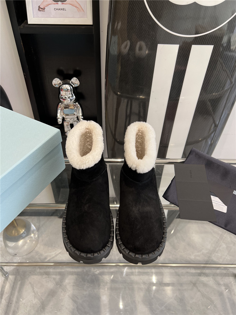 Pra*a triangle-logo suede boots in black