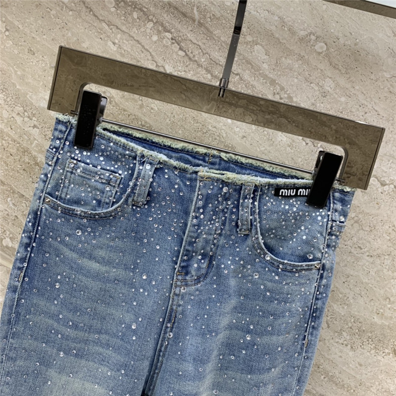 M1um1u micro logo embellished bootcut jeans