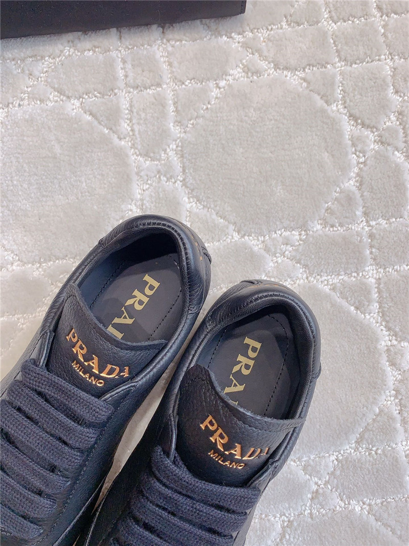 Pra*a triangle logo sneakers in black