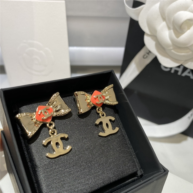 Ch**el orange bow engraved earrings