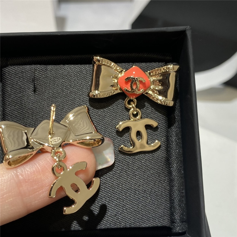 Ch**el orange bow engraved earrings