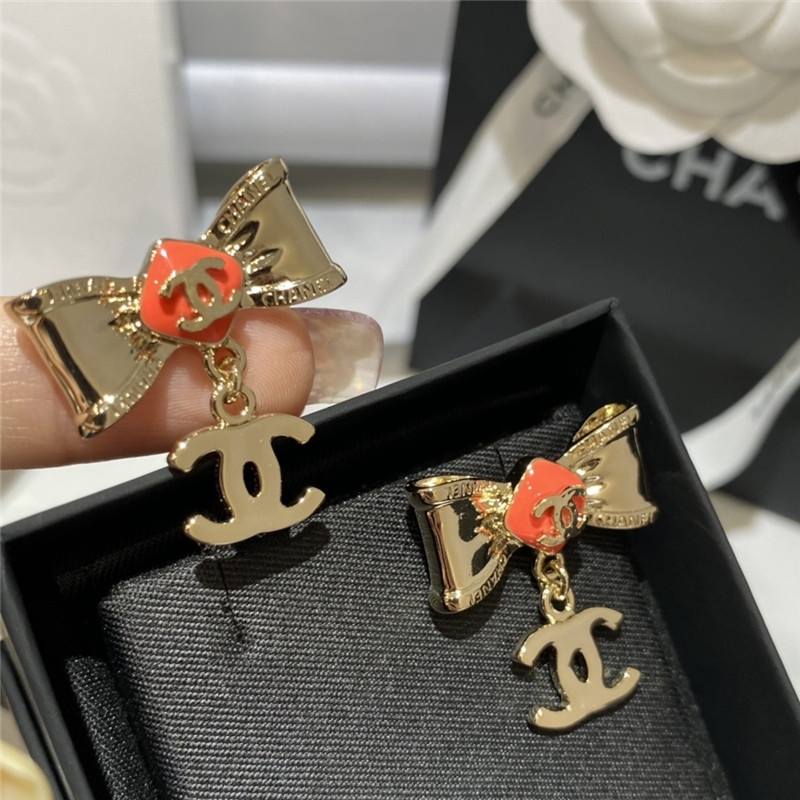 Ch**el orange bow engraved earrings
