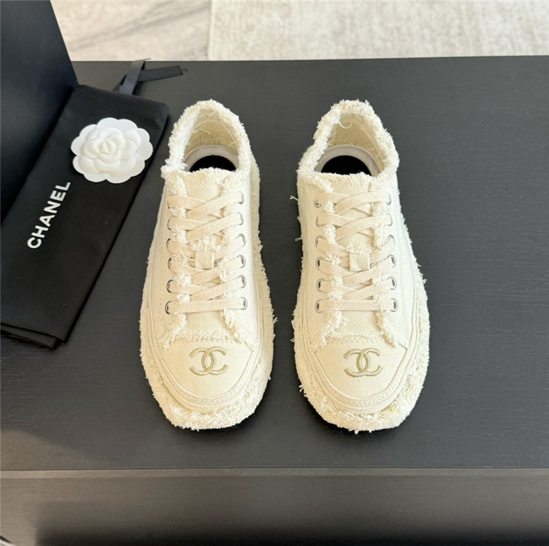 Ch**el lace-up canvas sneakers in white