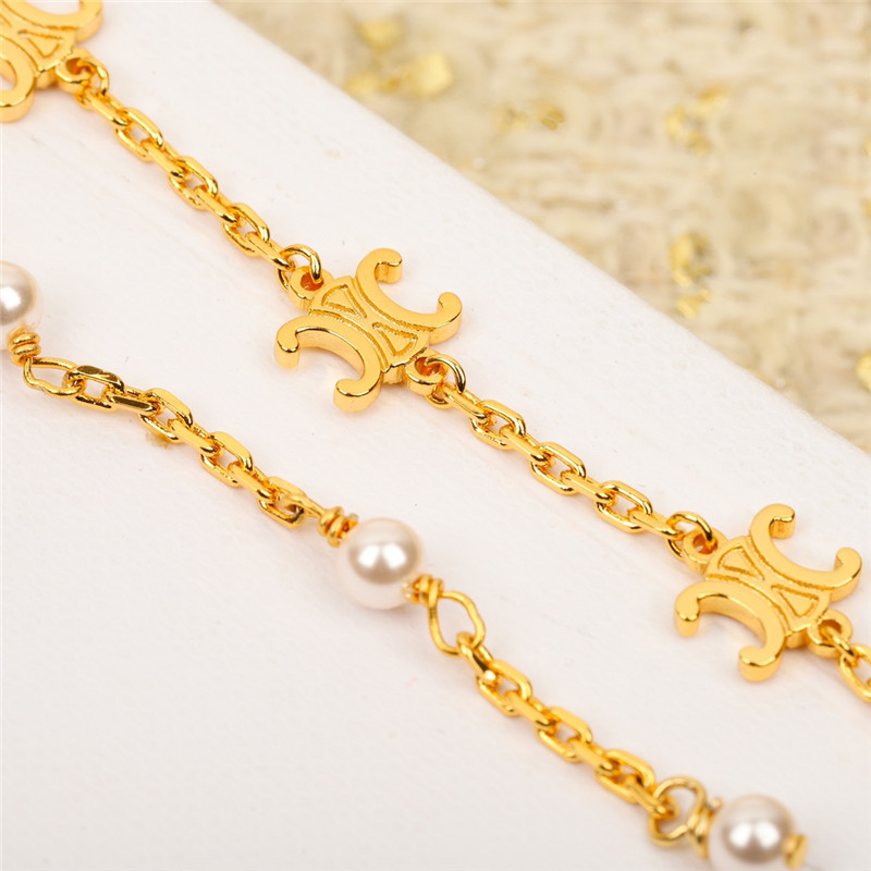 Ce1i*e three-dimensional arc de triomphe pearl earrings