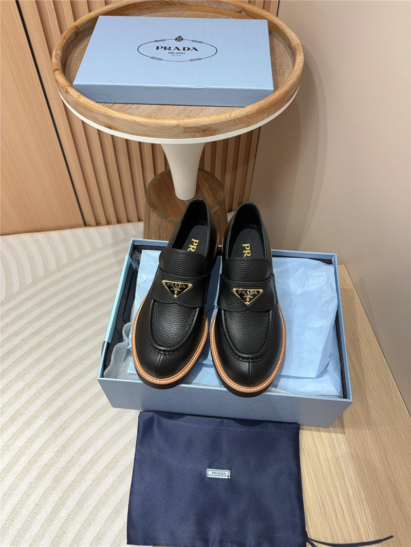 Pra*a black double chocolate leather loafers