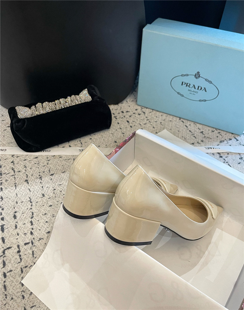 Pra*a triangle logo ivory brushed leather pumps
