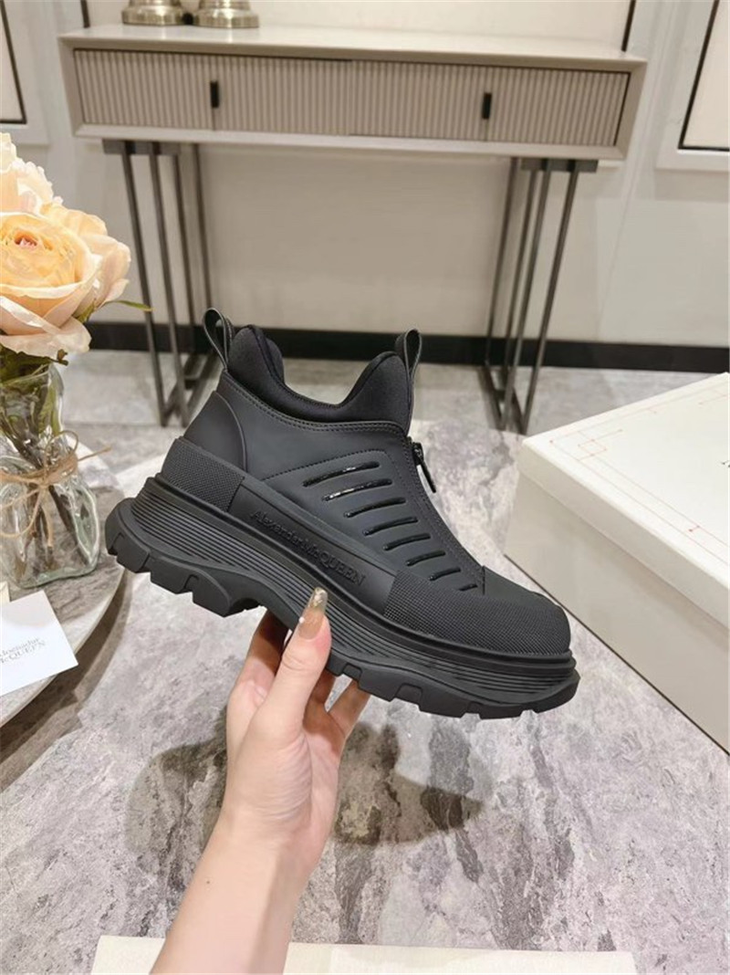 a1exa*der Mcqv*en black zip-up low top sneakers