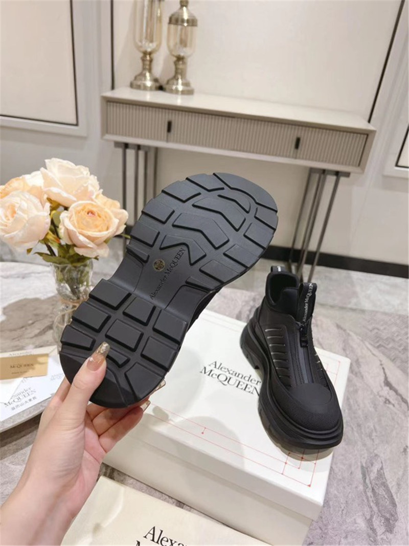 a1exa*der Mcqv*en black zip-up low top sneakers