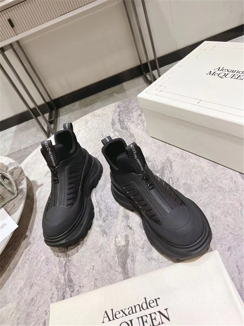 a1exa*der Mcqv*en black zip-up low top sneakers