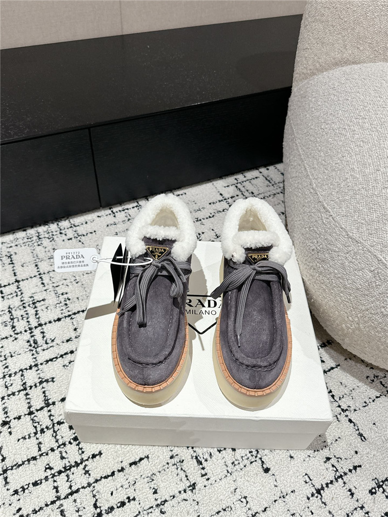 Pra*a gray suede shearling platform ankle boots