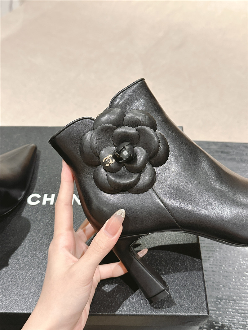 Ch**el heel black calfskin pointed toe boots