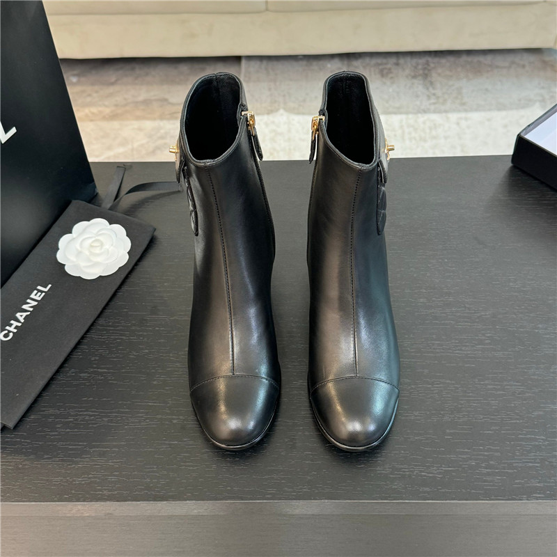 Ch**el black calfskin cap toe ankle boots