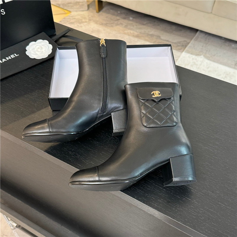 Ch**el black calfskin cap toe ankle boots