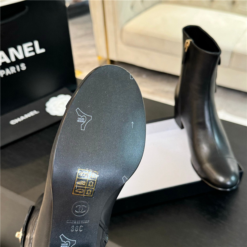 Ch**el black calfskin cap toe ankle boots