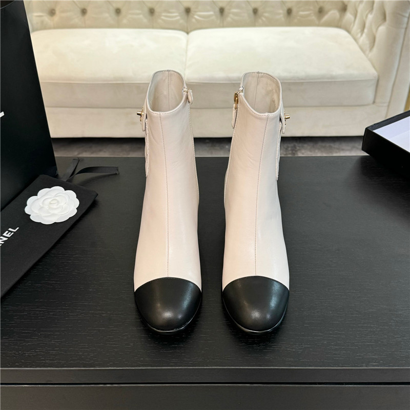 Ch**el calfskin cap toe ankle boots in white