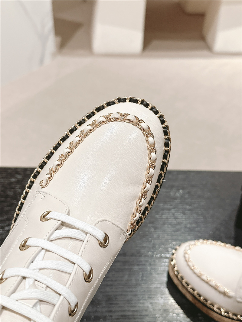 Ch**el lace-up calfskin flat ankle boots in white