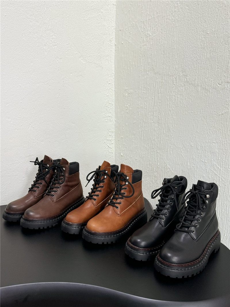 Pra*a black leather and re-nylon booties