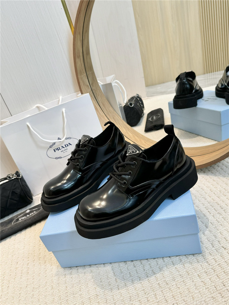Pra*a leather triangle logo loafers