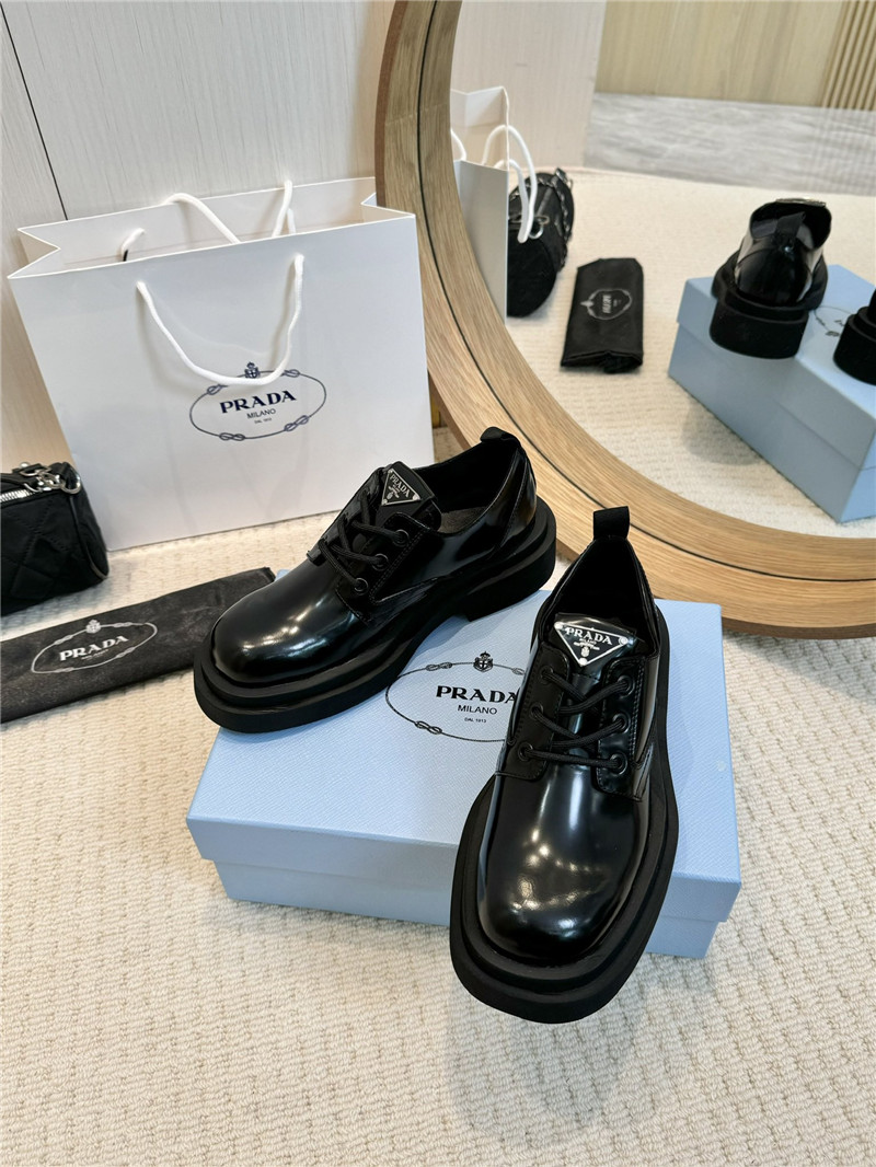 Pra*a leather triangle logo loafers
