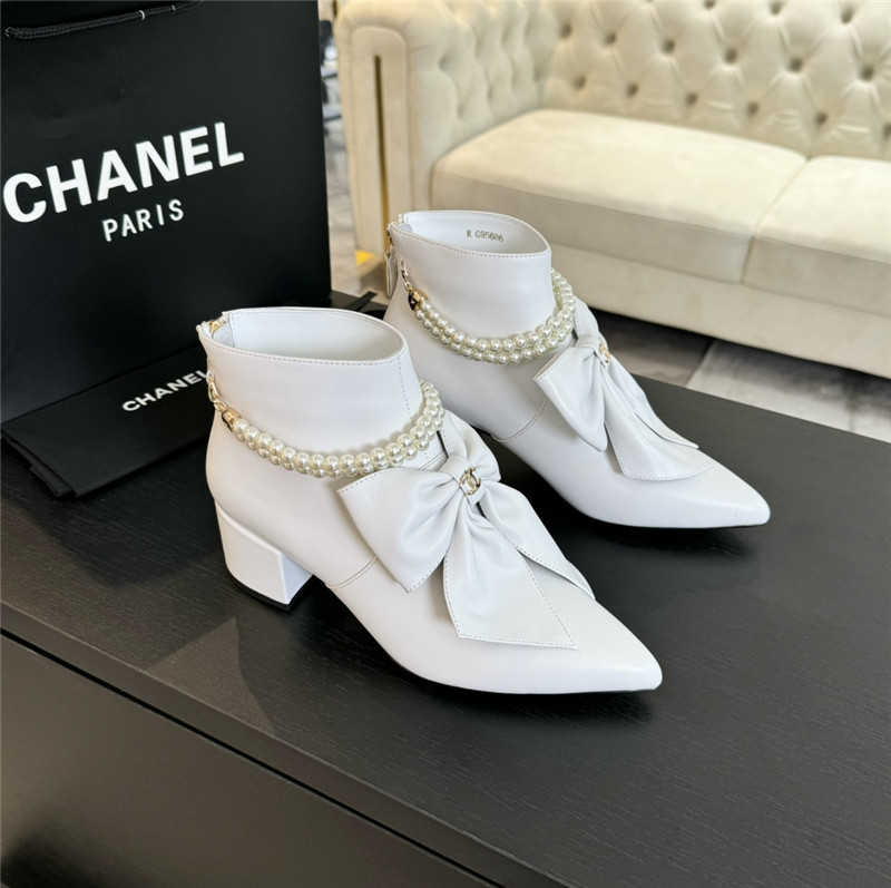 Ch**el black pointed toe pearl bow ankle boots