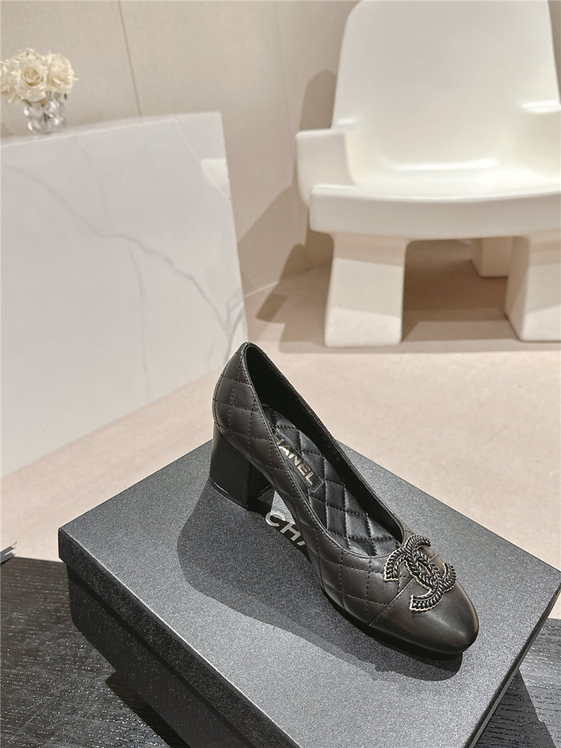 Ch**el black quilted leather cap toe pumps