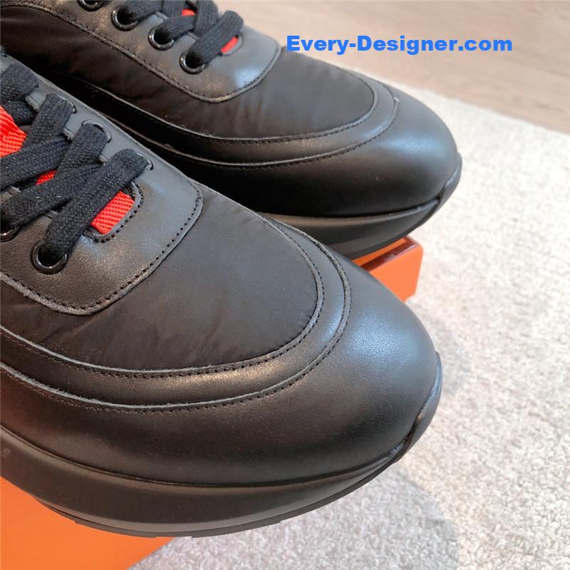 H**me5 black orange bouncing sneakers