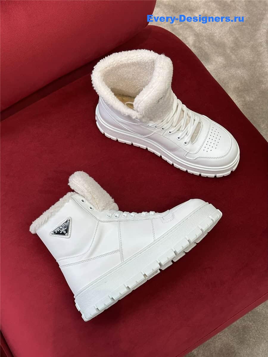 Pra*a white triangle-logo high-top leather sneakers