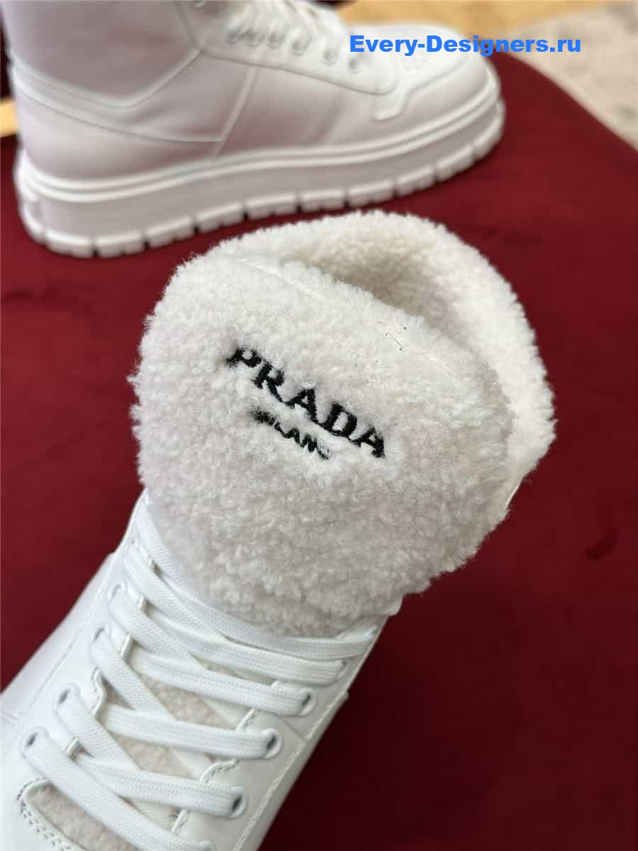Pra*a white triangle-logo high-top leather sneakers