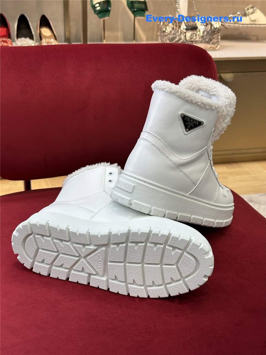 Pra*a white triangle-logo high-top leather sneakers
