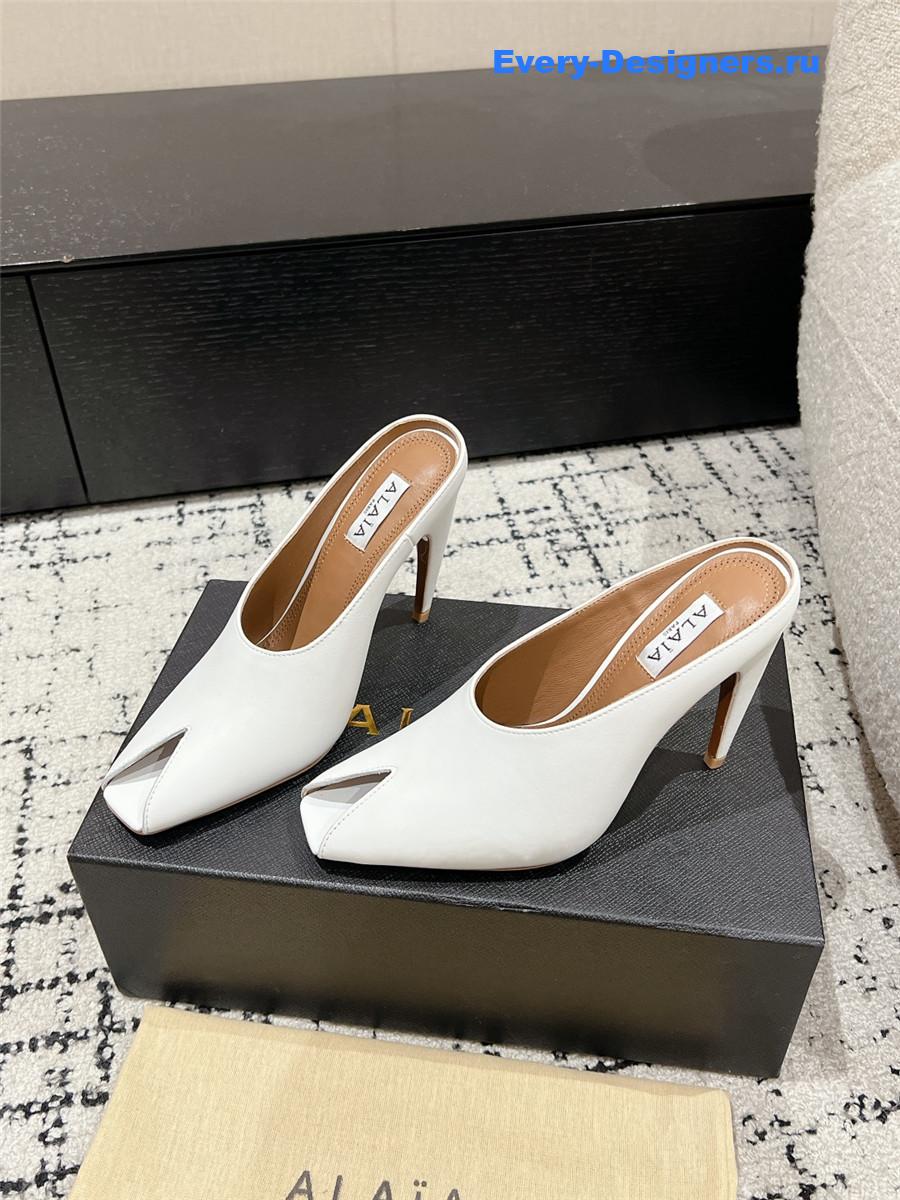 Alaia White Spike Mules in Calfskin