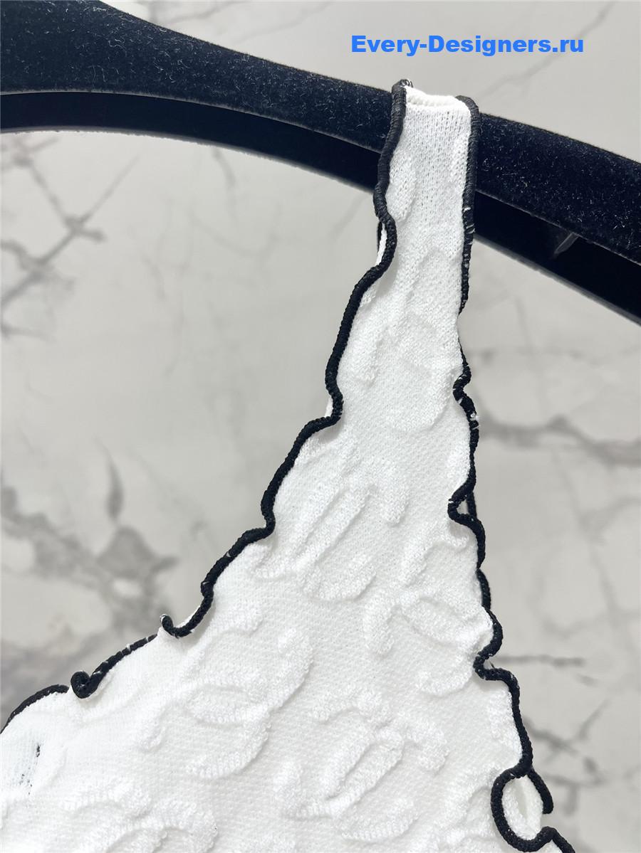 Ch**el embroidered wool-silk top in white