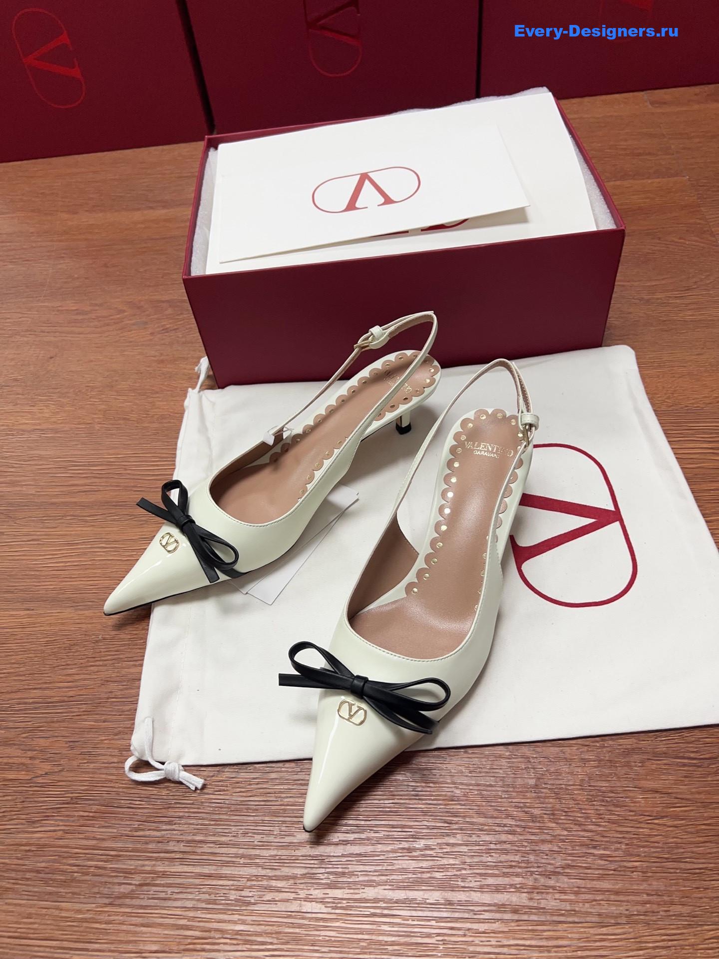 Va1e*ntin0 garavani white bow slingback pumps