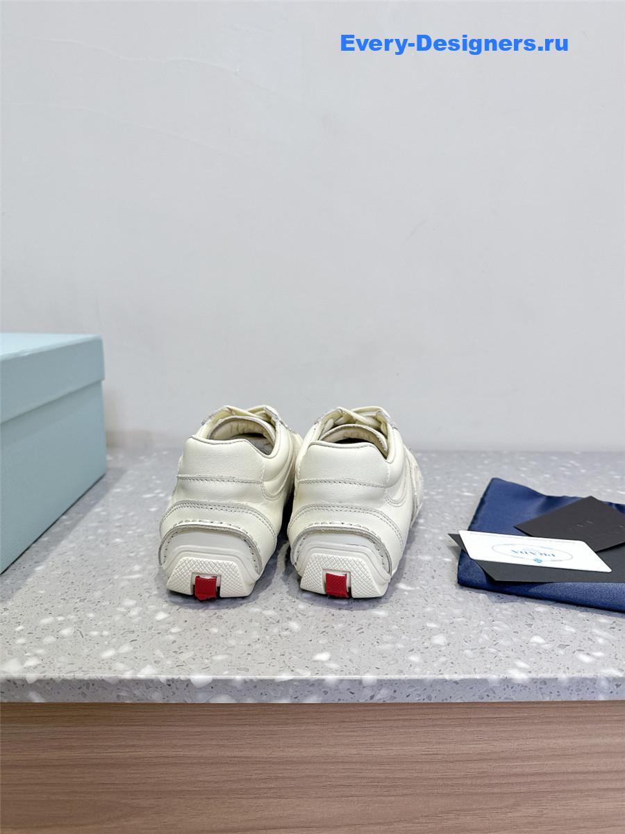 Pra*a white leather low-top sneakers