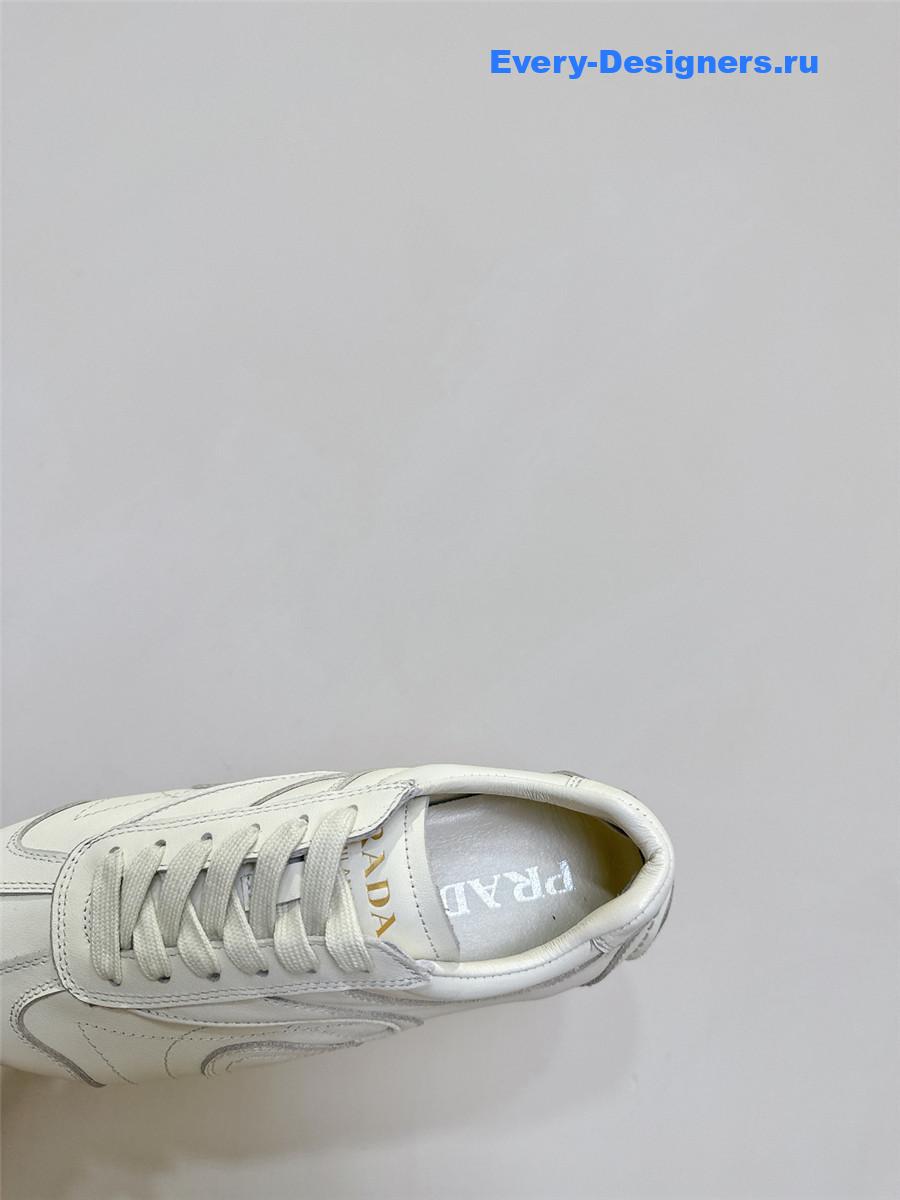 Pra*a white leather low-top sneakers