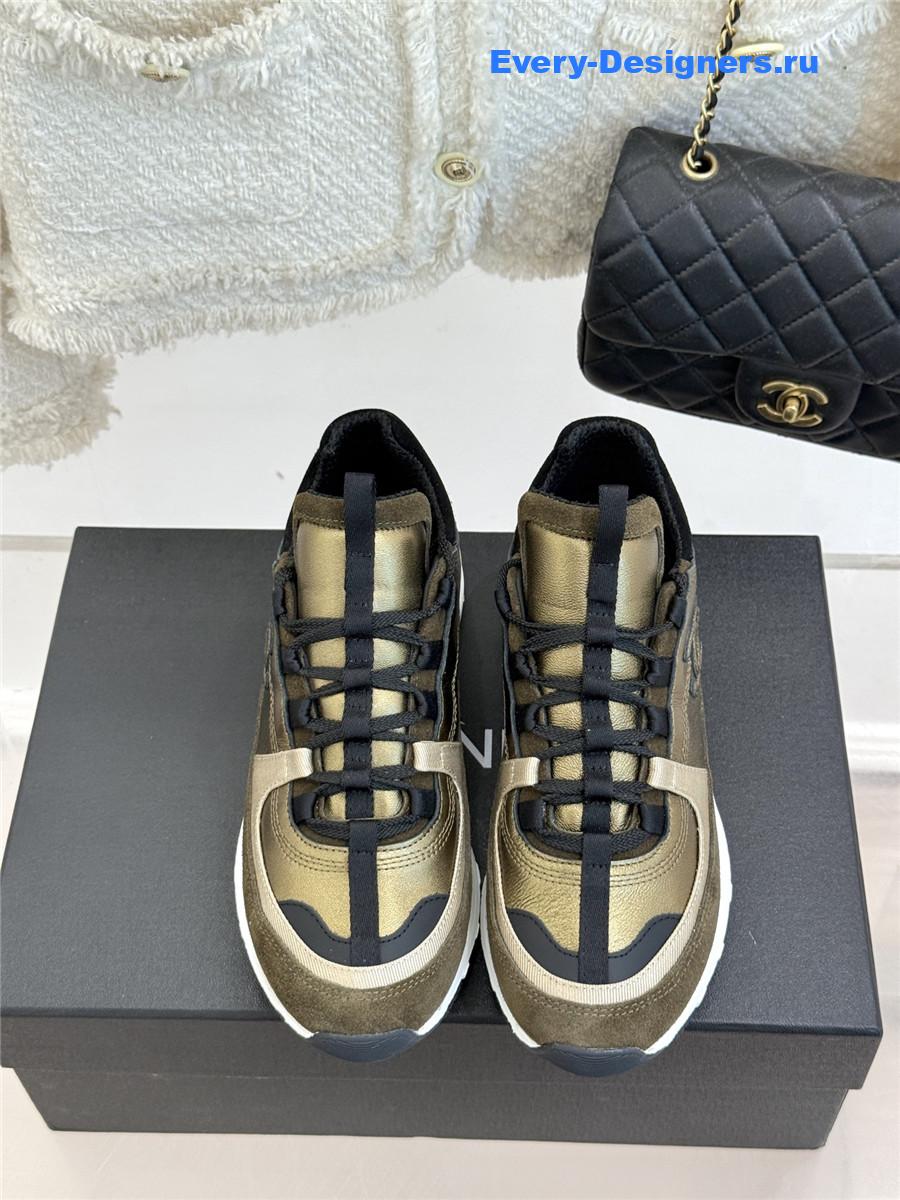 Ch**el laminated calfskin suede gold trainers