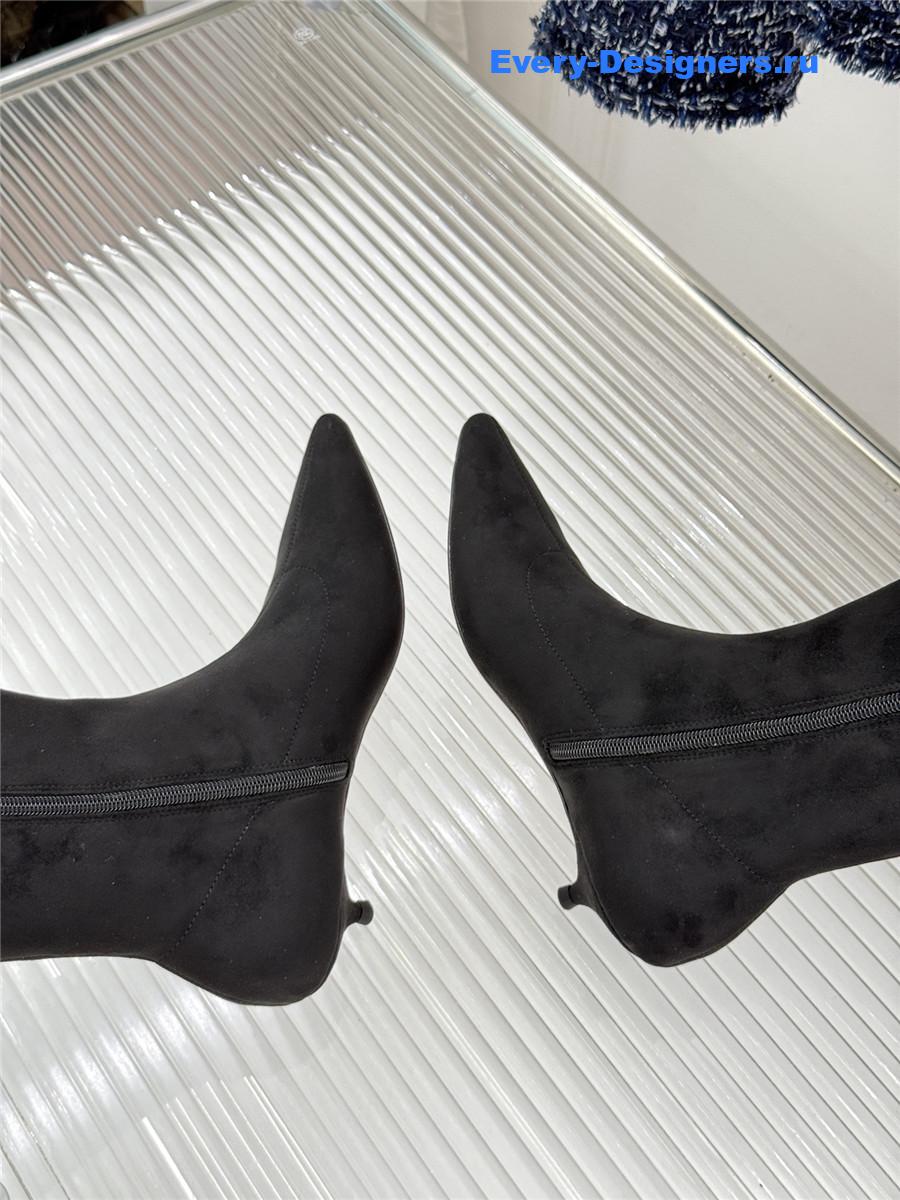 The R0w black suede pointy toe knee-high boots