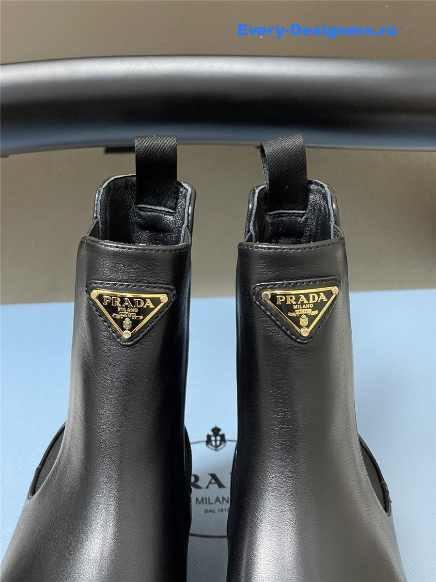 Pra*a black monolith brushed leather booties
